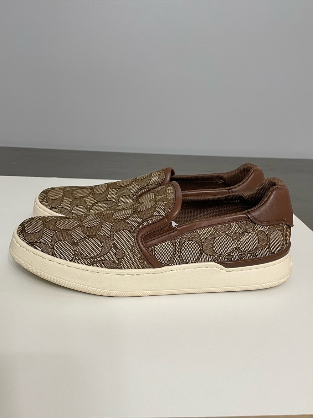 Coach Brown 7.5 woman’s Logo Slip-On Sneakers with Ivory Soles